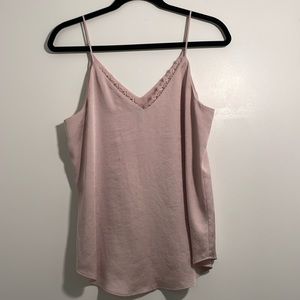Baby pink top with lace detailing at the v-neck